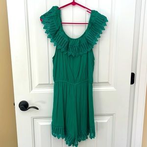 Green romper with cute patterned shoulder straps